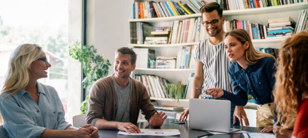 team of people working on digital marketing strategies in an office setting